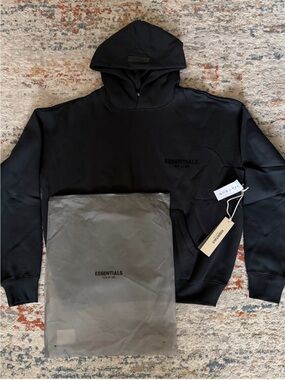 Essentials Black Pullover Hoodie with Subtle Chest Logo